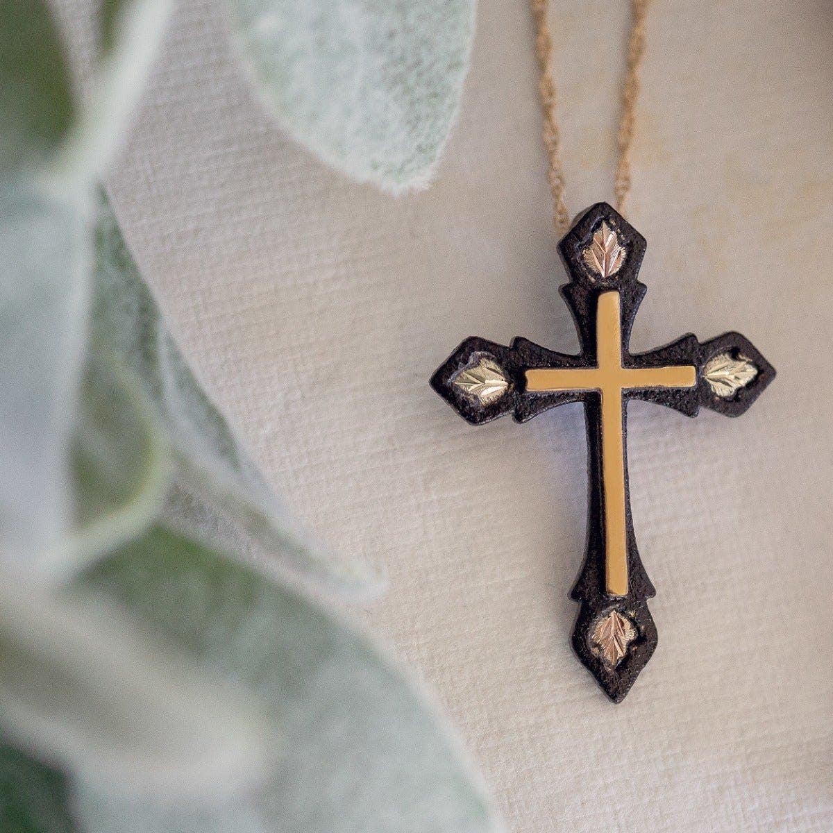 Four leaf black powder coated cross pendant by Mt. Rushmore Black Hills Gold