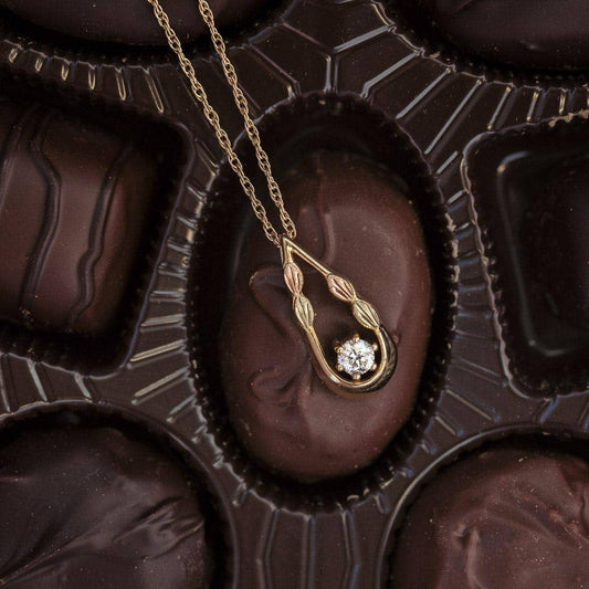 10K yellow gold noventa and Black Hills Gold 1/3 ct. tw. round diamond teardrop pendant