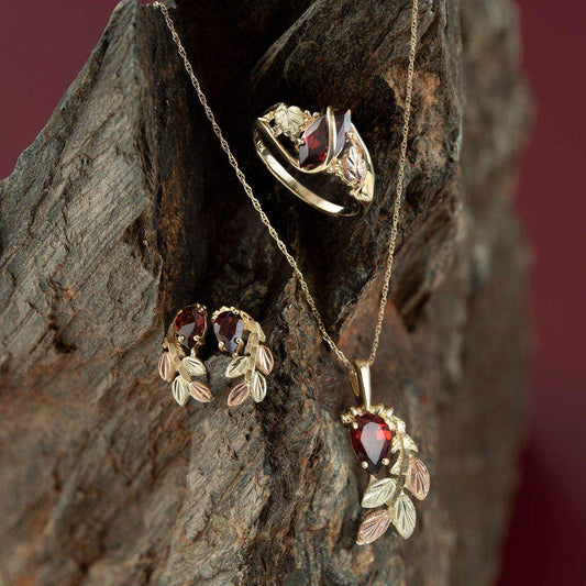 10K yellow gold pear garnet and leaf branch pendant by Mt. Rushmore Black Hills Gold