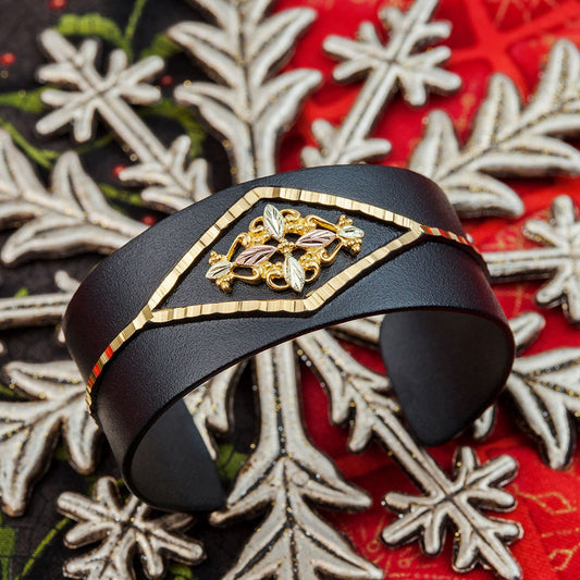 Leaf and vine black powder coated cuff bracelet by Landstrom's Black Hills Gold, styled view