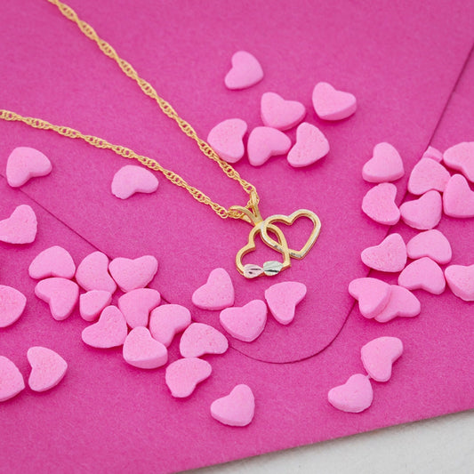 10K yellow gold interlocking heart pendant by Landstrom's Black Hills Gold, styled view