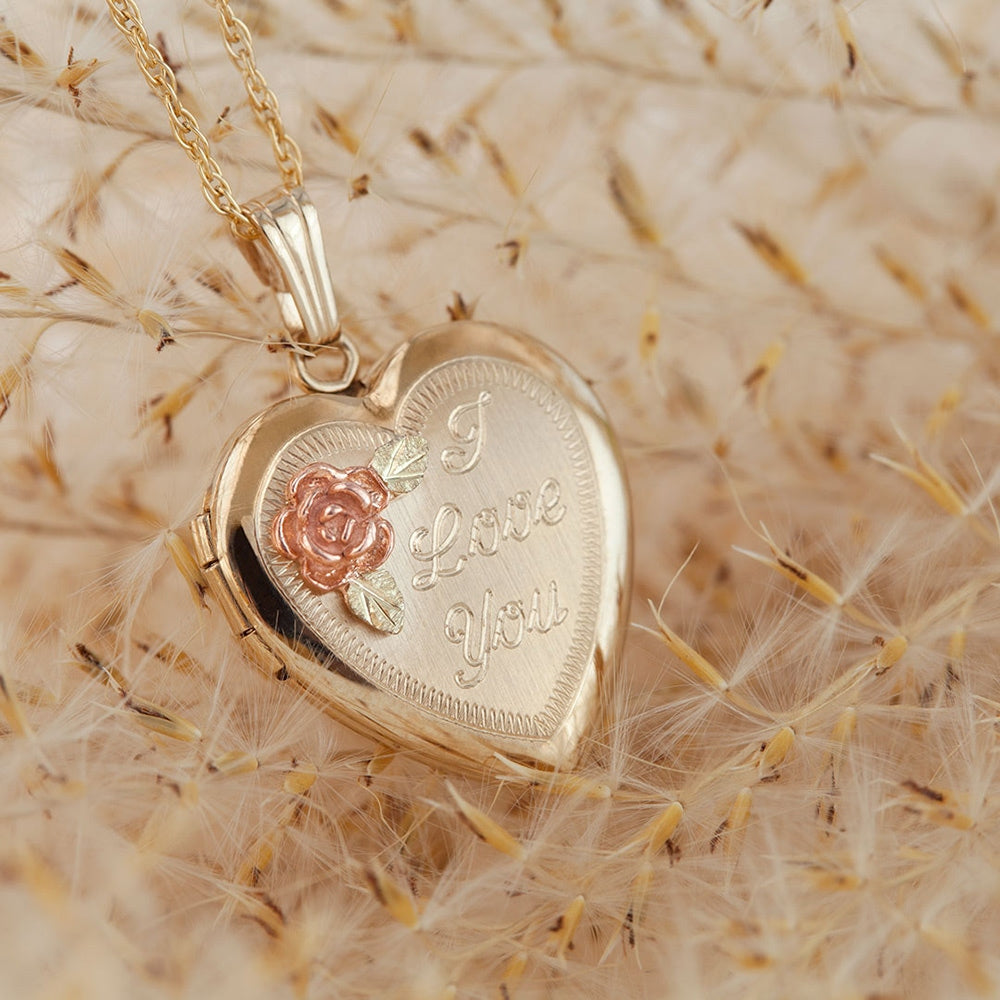 Rose and i love you 10K yellow gold filled heart locket by Landstrom's Black Hills Gold, styled view