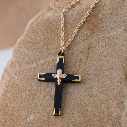 Triple leaf and grape black powder coated cross pendant by Landstrom's Black Hills Gold, styled view