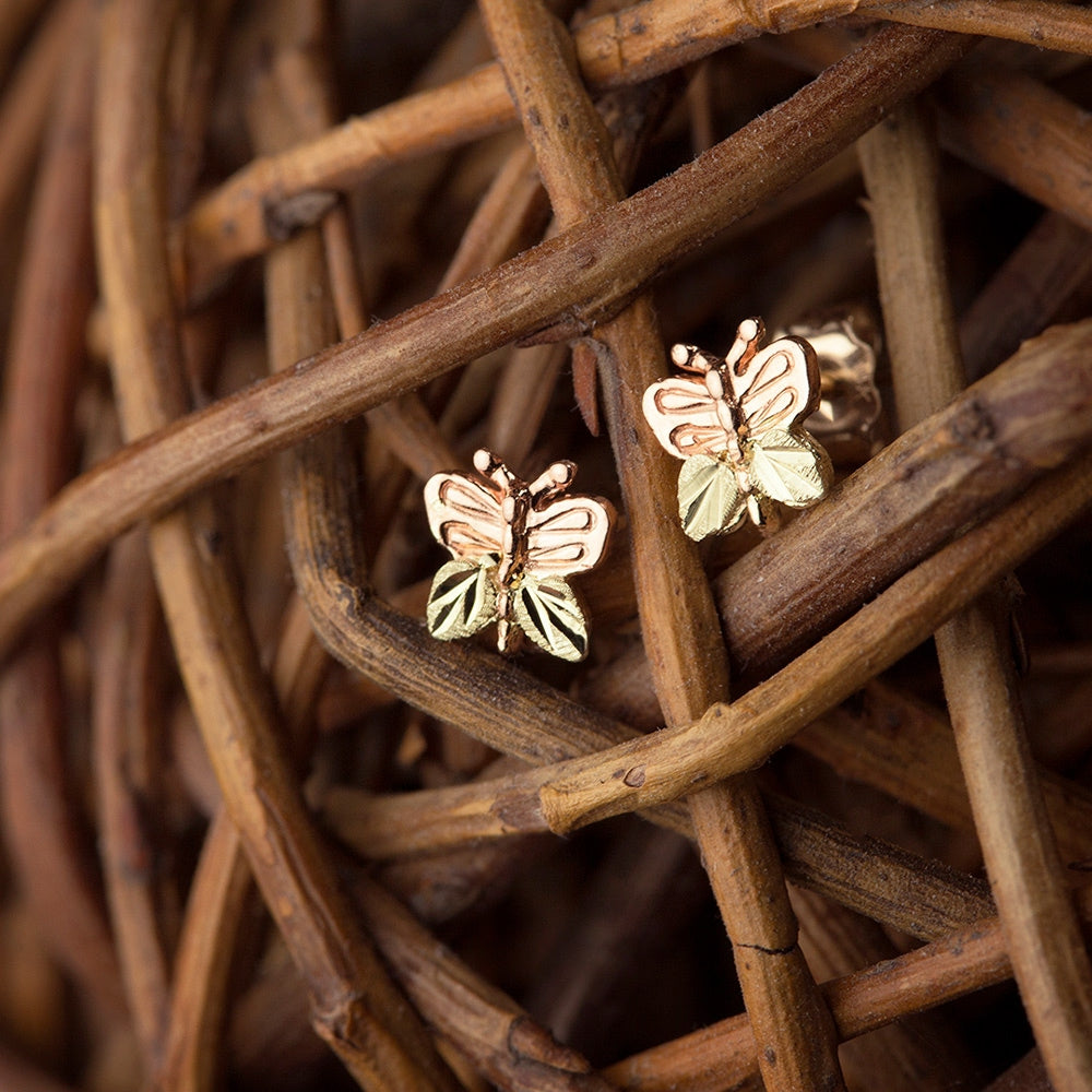 10K pink gold butterfly earrings by Landstrom's Black Hills Gold, styled view