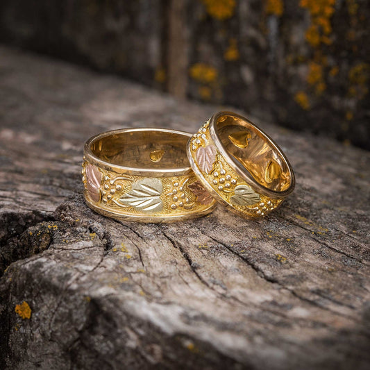 14K yellow gold leaf and grape eternity wedding ring by Landstrom's Black Hills Gold, styled view