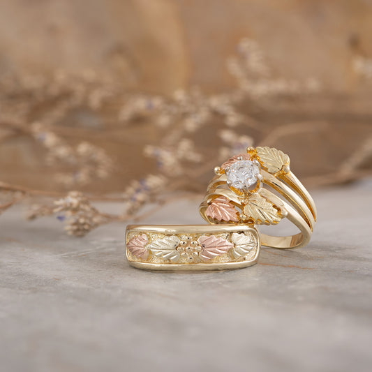 10K yellow gold men's four leaf and grape cluster wedding ring by Landstrom's Black Hills Gold, styled view