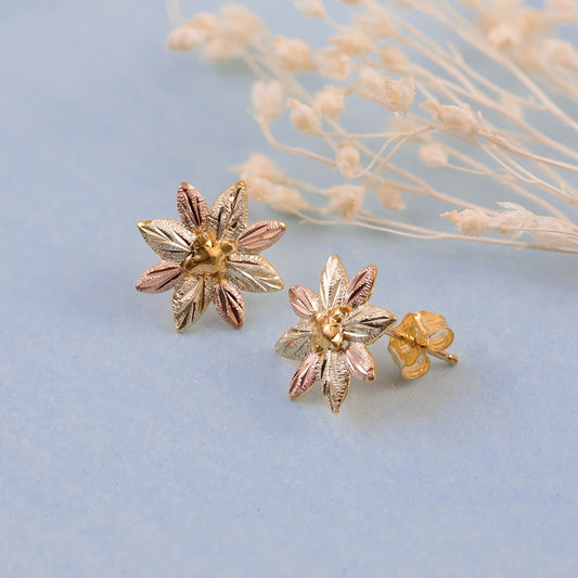 10K yellow gold leaf and grape flower earrings by Landstrom's Black Hills Gold, styled view