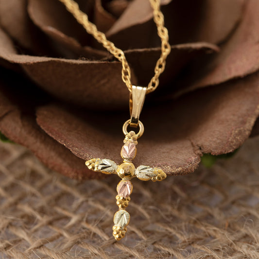 10K yellow gold alternating leaf and grape cross pendant by Landstrom's Black Hills Gold, styled view