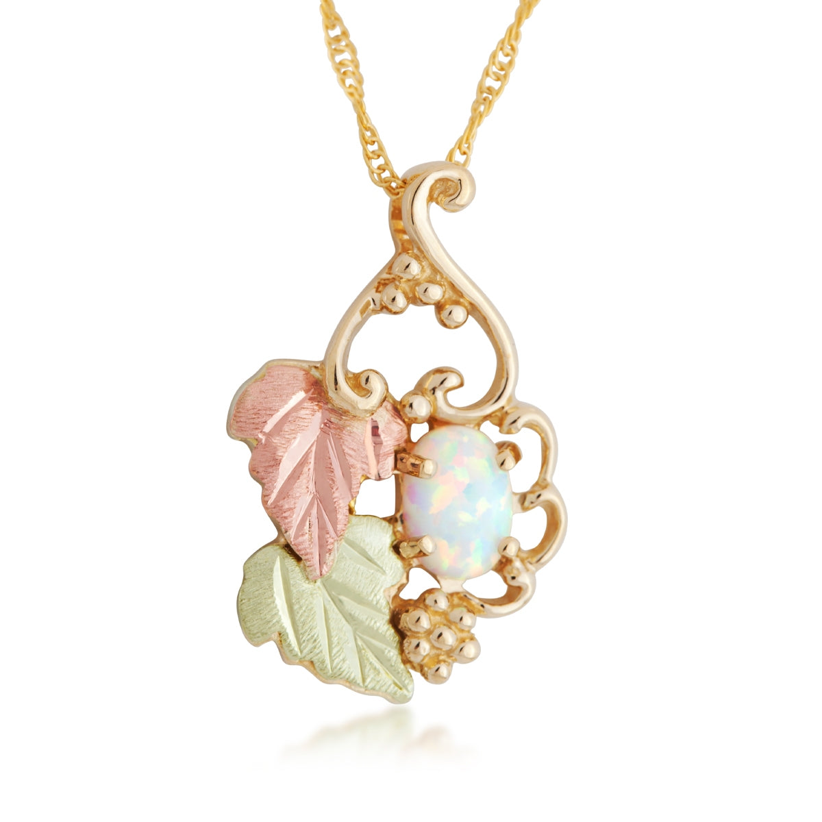10K yellow gold created oval opal grapevine pendant by Landstrom's Black Hills Gold