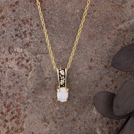 10K yellow gold created oval opal antiqued pendant by Landstrom's Black Hills Gold, styled view