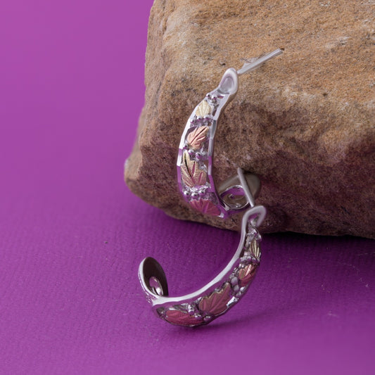 Sterling silver diamond cut j hoop earrings by Landstrom's Black Hills Gold, styled view