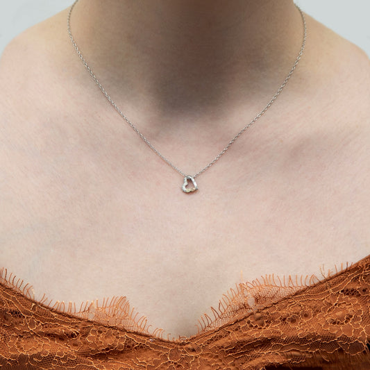 Sterling silver textured floating heart pendant by Landstrom's Black Hills Gold, shown worn