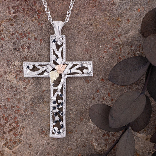 Sterling silver diamond cut open cross pendant by Landstrom's Black Hills Gold, styled view