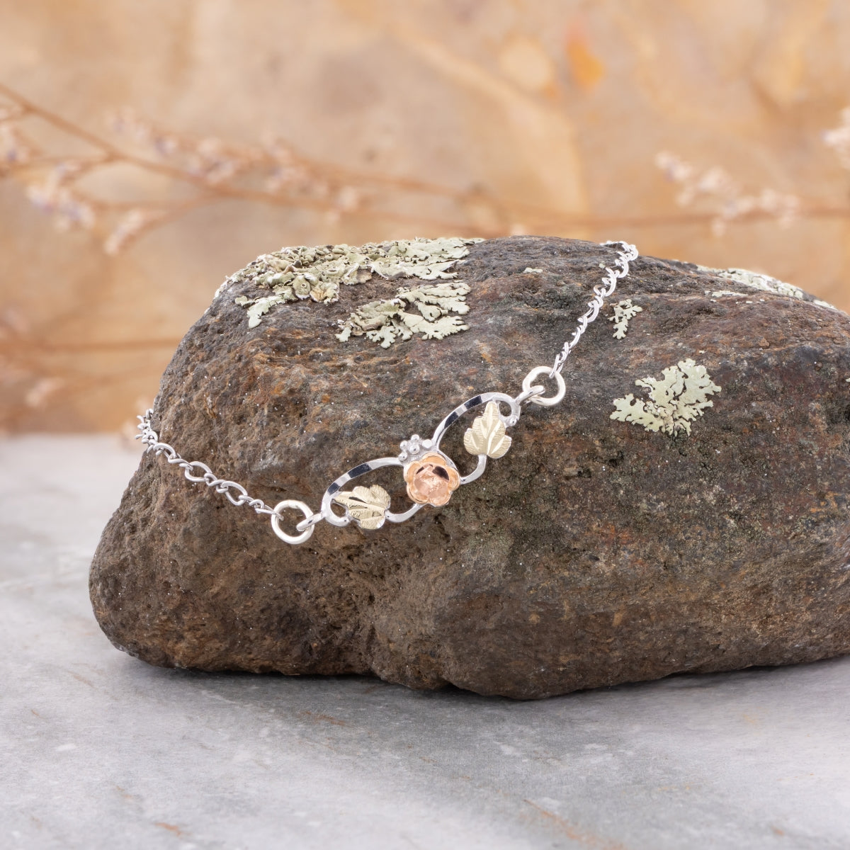 Sterling silver 9" rose bracelet by Landstrom's Black Hills Gold, styled view