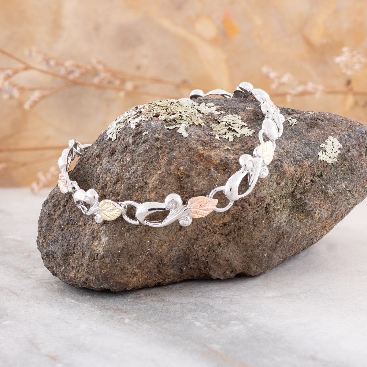 Sterling silver loop link bracelet by Landstrom's Black Hills Gold, styled view