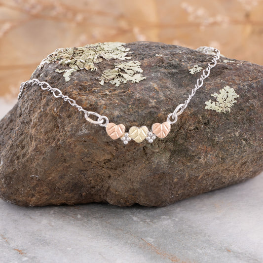 Sterling silver 9" three leaf ankle bracelet by Landstrom's Black Hills Gold, styled view