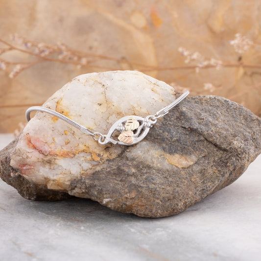 Sterling silver 8" open marquise leaf bracelet by Landstrom's Black Hills Gold, styled view