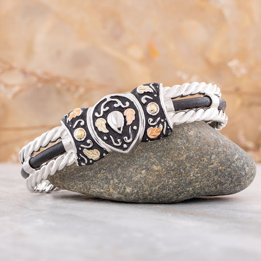 Sterling silver antiqued rope edge cuff bracelet by Landstrom's Black Hills Gold, styled view