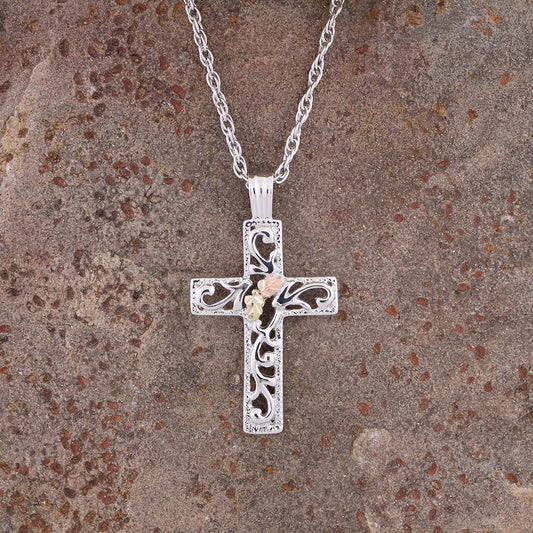Sterling silver leaf center open cross pendant by Landstrom's Black Hills Gold, styled view