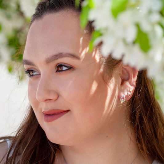 Sterling silver diamond accent open teardrop earrings by Landstrom's Black Hills Gold, shown worn