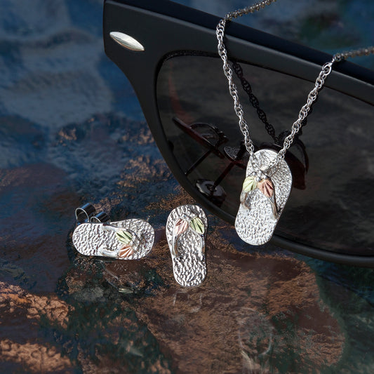 Sterling silver flip flop earrings by Landstrom's Black Hills Gold, styled view