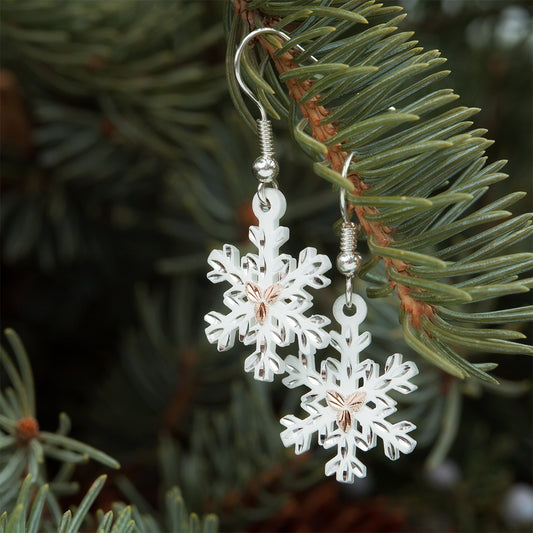 Snowflake white powder coated dangle earrings by Landstrom's Black Hills Gold, styled view