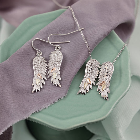 Sterling silver angel wings pendant by Landstrom's Black Hills Gold, styled view