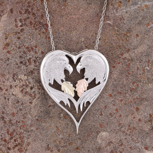 Sterling silver eagle heart pendant by Landstrom's Black Hills Gold, styled view