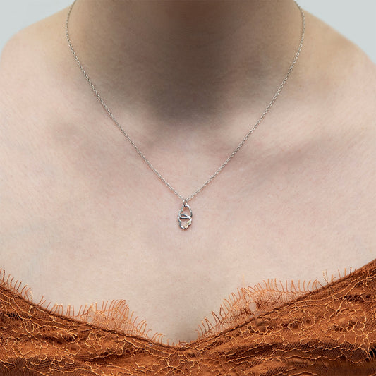 Sterling silver double heart pendant by Landstrom's Black Hills Gold, shown worn