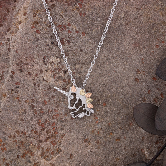 Sterling silver unicorn head pendant by Landstrom's Black Hills Gold, styled view