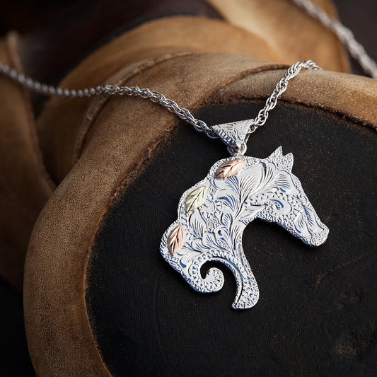 Sterling silver textured horse head pendant by Landstrom's Black Hills Gold, styled view