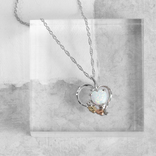 Sterling silver created heart opal pendant by Landstrom's Black Hills Gold, styled view