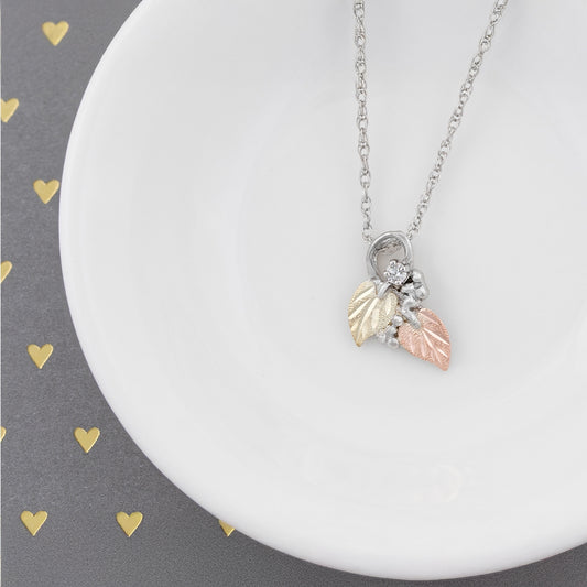 Sterling silver diamond accent double leaf pendant by Landstrom's Black Hills Gold, styled view
