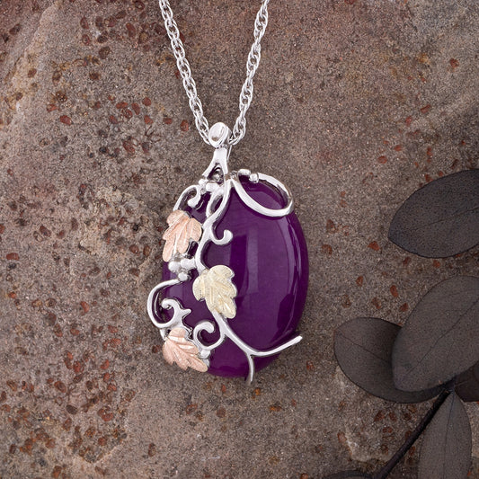 Sterling silver purple oval quartz pendant by Landstrom's Black Hills Gold, styled view