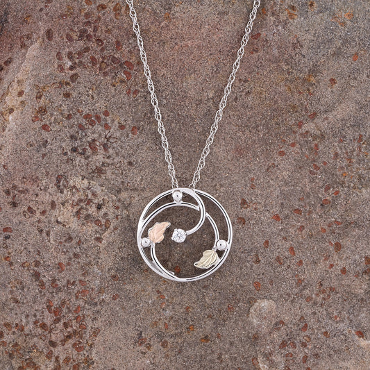 Sterling silver cubic zirconia open circle pendant by Landstrom's Black Hills Gold, styled view