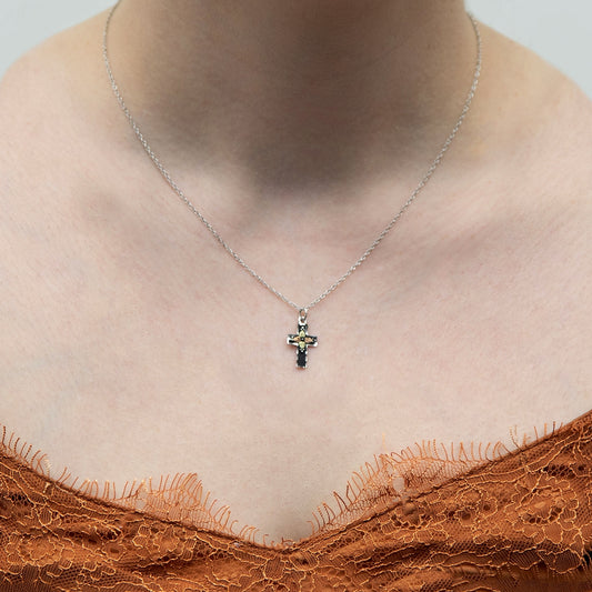 Sterling silver diamond cut edge antiqued cross pendant by Landstrom's Black Hills Gold, shown worn