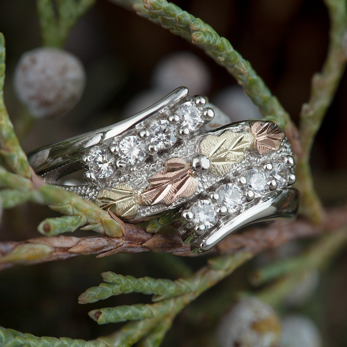 Sterling silver cubic zirconia and leaf wrap ring by Landstrom's Black Hills Gold, styled view