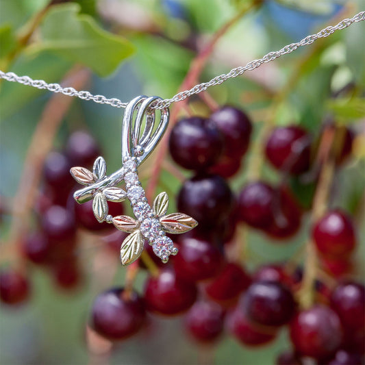 Sterling silver cubic zirconia dragonfly pendant by Landstrom's Black Hills Gold, styled view