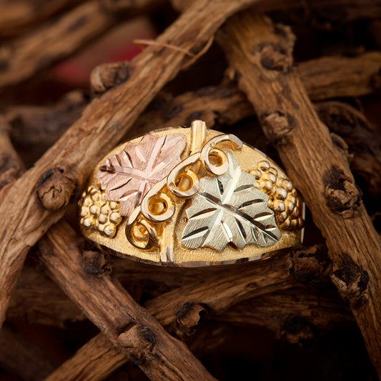 10K yellow gold men's double leaf and grape cluster ring by Landstrom's Black Hills Gold, styled view