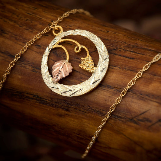 10K yellow gold textured green circle pendant by Mt. Rushmore Black Hills Gold, styled view