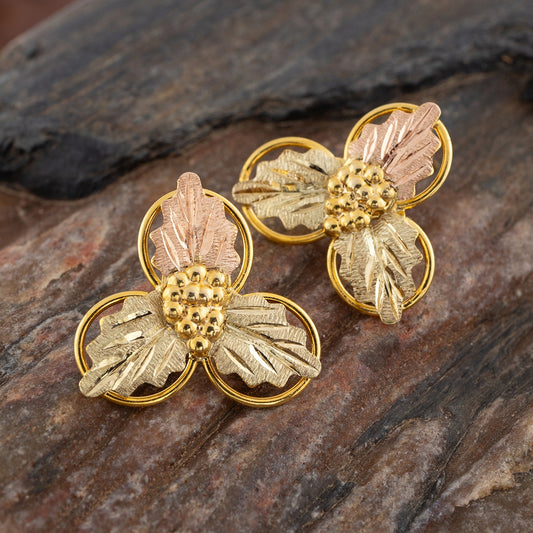10K yellow gold triple loop drop earrings by Landstrom's Black Hills Gold, styled view