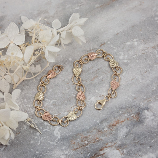 10K yellow gold 7.5" filigree link bracelet by Mt. Rushmore Black Hills Gold, styled view