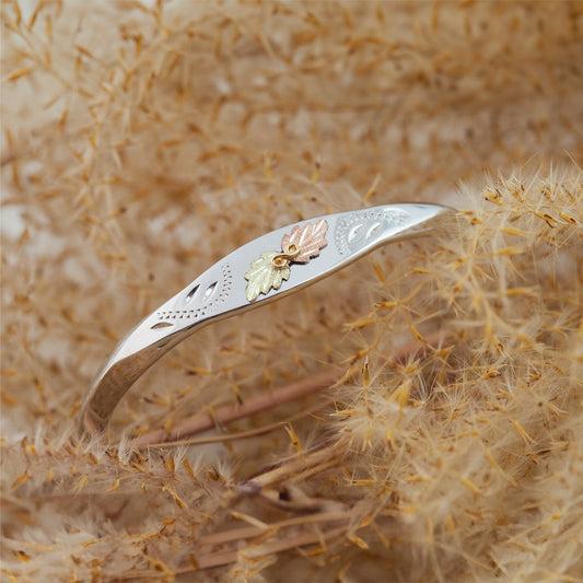 Sterling silver knife edge cuff bracelet by Landstrom's Black Hills Gold, styled view