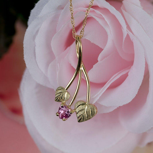10K yellow gold created heart pink sapphire and double green leaf pendant by Mt. Rushmore Black Hills Gold