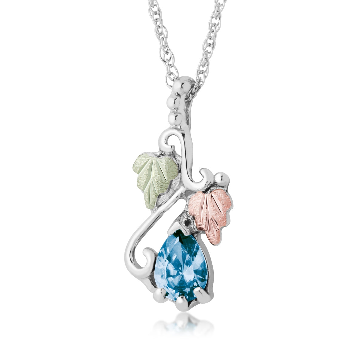 Sterling silver synthetic pear blue topaz vine and leaf drop pendant by Landstrom's Black Hills Gold