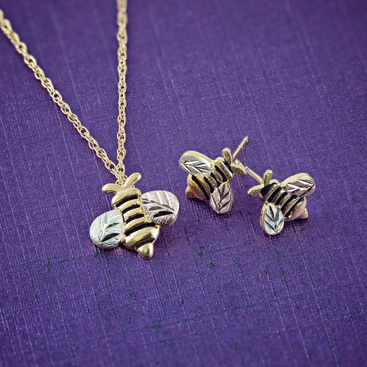 10K yellow gold bee earrings by Landstrom's Black Hills Gold, styled view