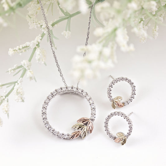 Sterling silver cubic zirconia circle pendant by Landstrom's Black Hills Gold, styled view