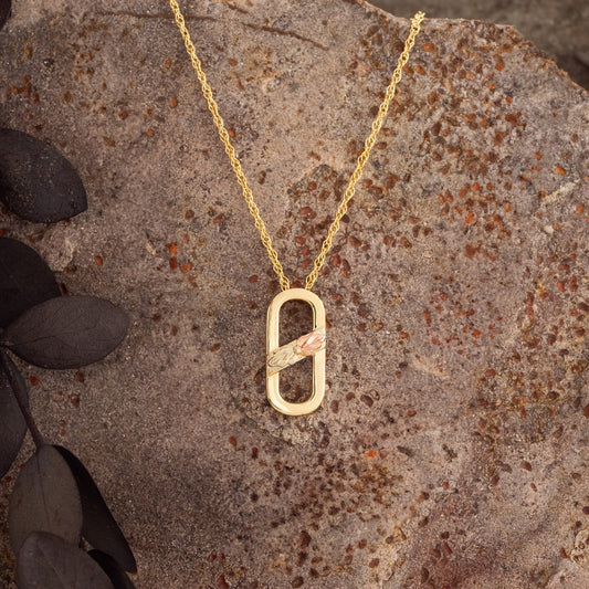 10K yellow gold paperclip pendant by Landstrom's Black Hills Gold, styled view