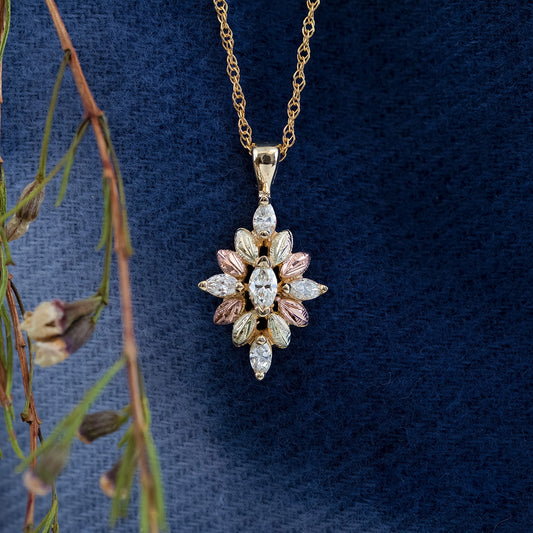 10K yellow gold 1/2 ct. tw. marquise diamond floral pendant by Landstrom's Black Hills Gold, styled view
