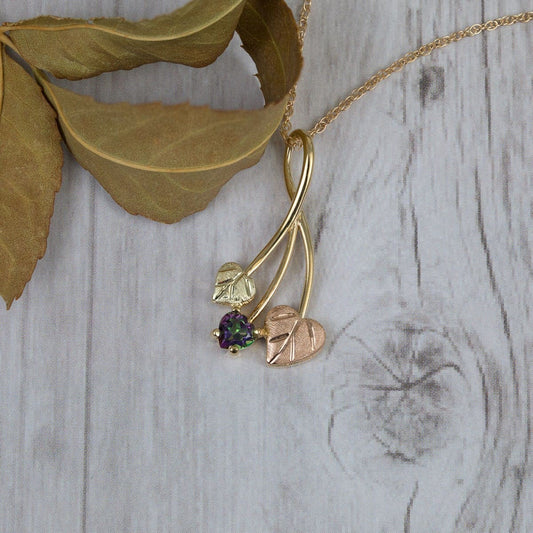 10K yellow gold heart mystic fire topaz and double leaf pendant by Mt. Rushmore Black Hills Gold